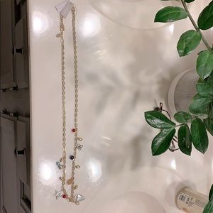 Chico’s gold long charm necklace